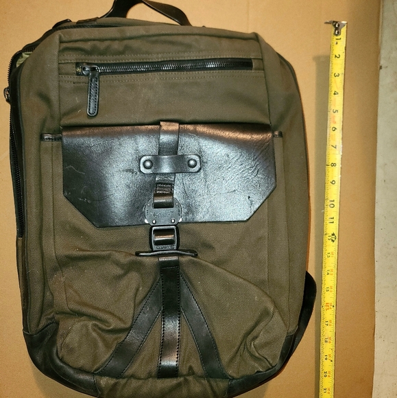 allen edmonds canvas and leather backpack | MALM polyester fabric CRAFT Made from supple leather Brass hardware with gunmetal finish Imported Wallets and Bags | Evolved
